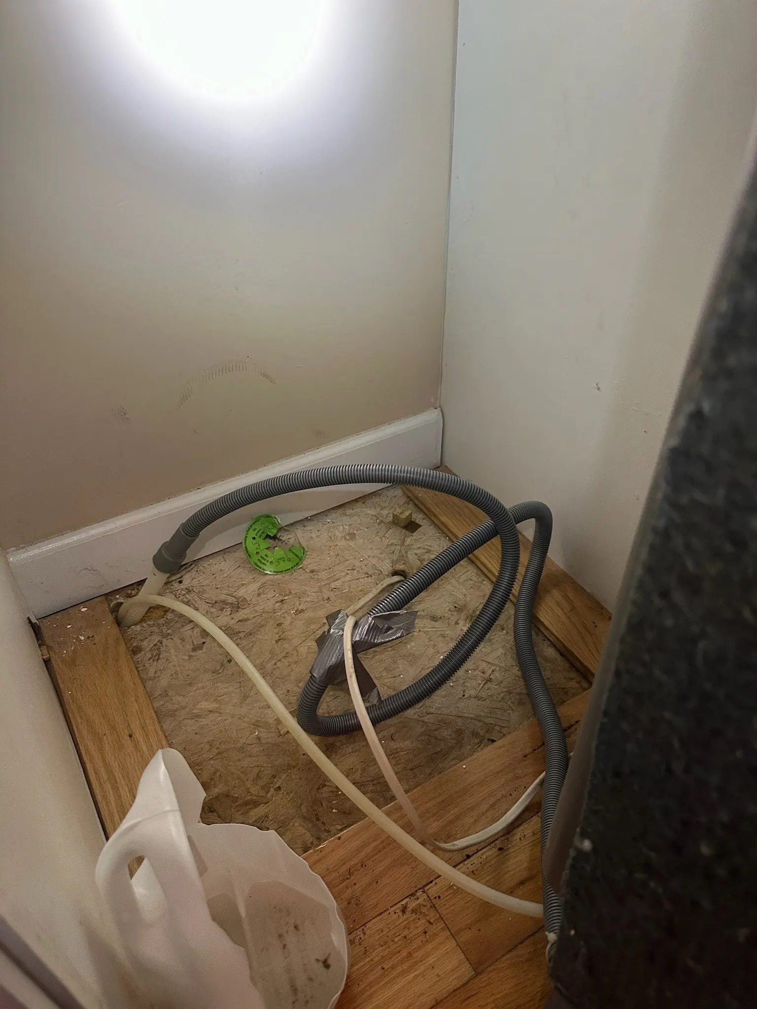 Properly routed dishwasher drain line secured under a kitchen cabinet photo 2